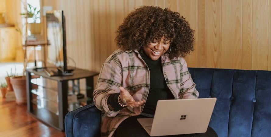 happy woman using laptop