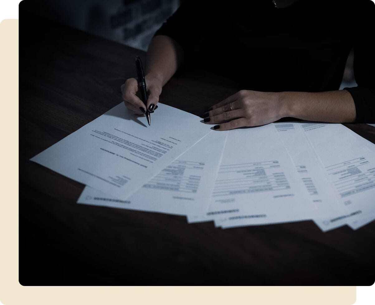 Woman signing some paperwork