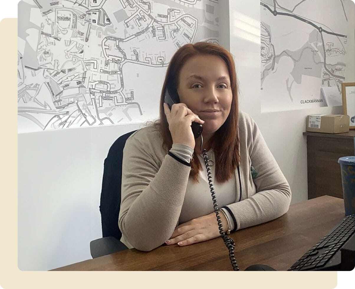 Stacey Stevenson on the phone in the office