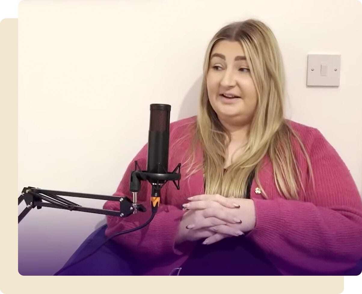Stephanie English recording a podcast with a mircophone